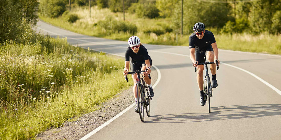Cyclist wearing black padded bike shorts riding a road bike outdoors